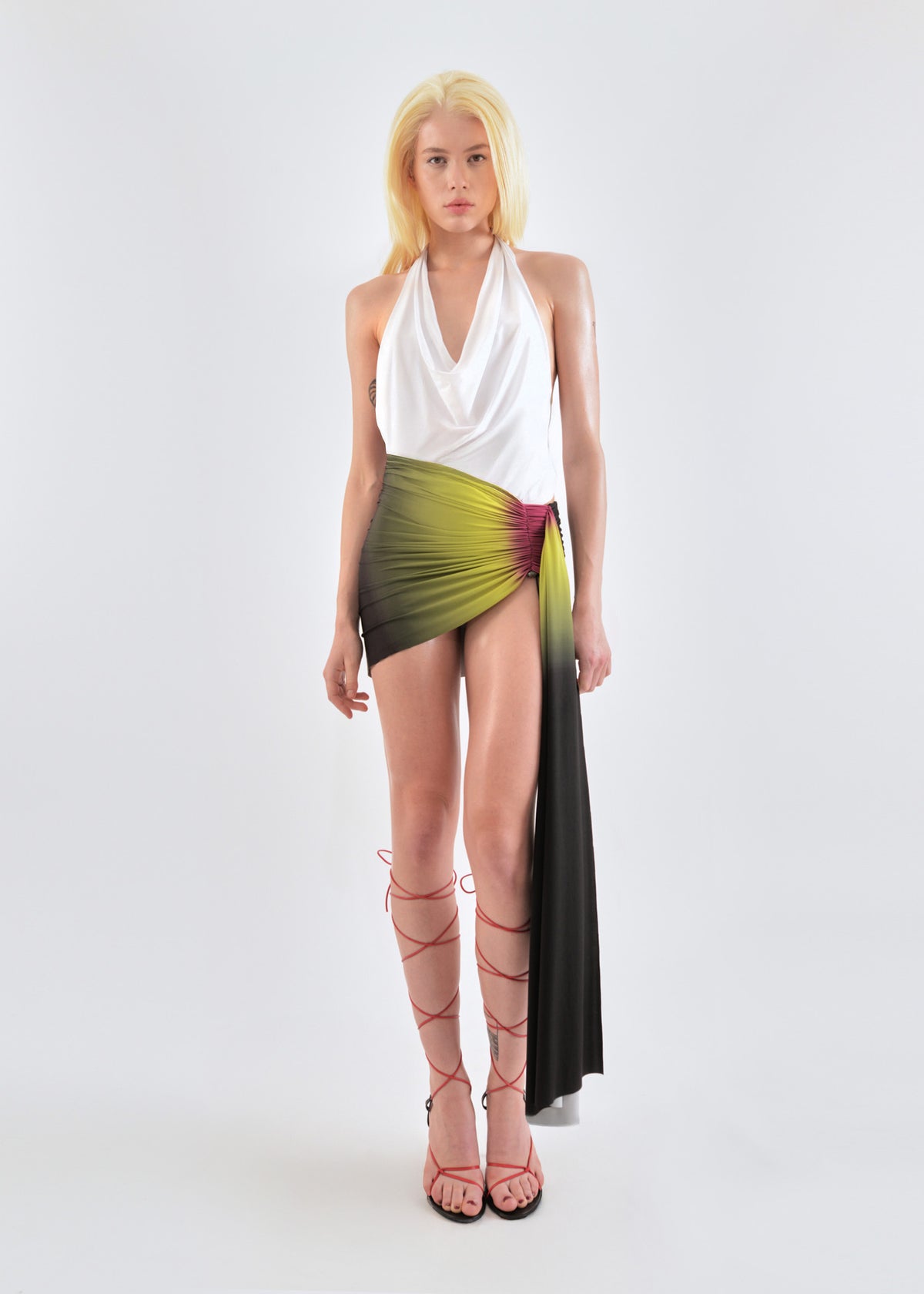 Signature mini jersey skirt in lime/wine