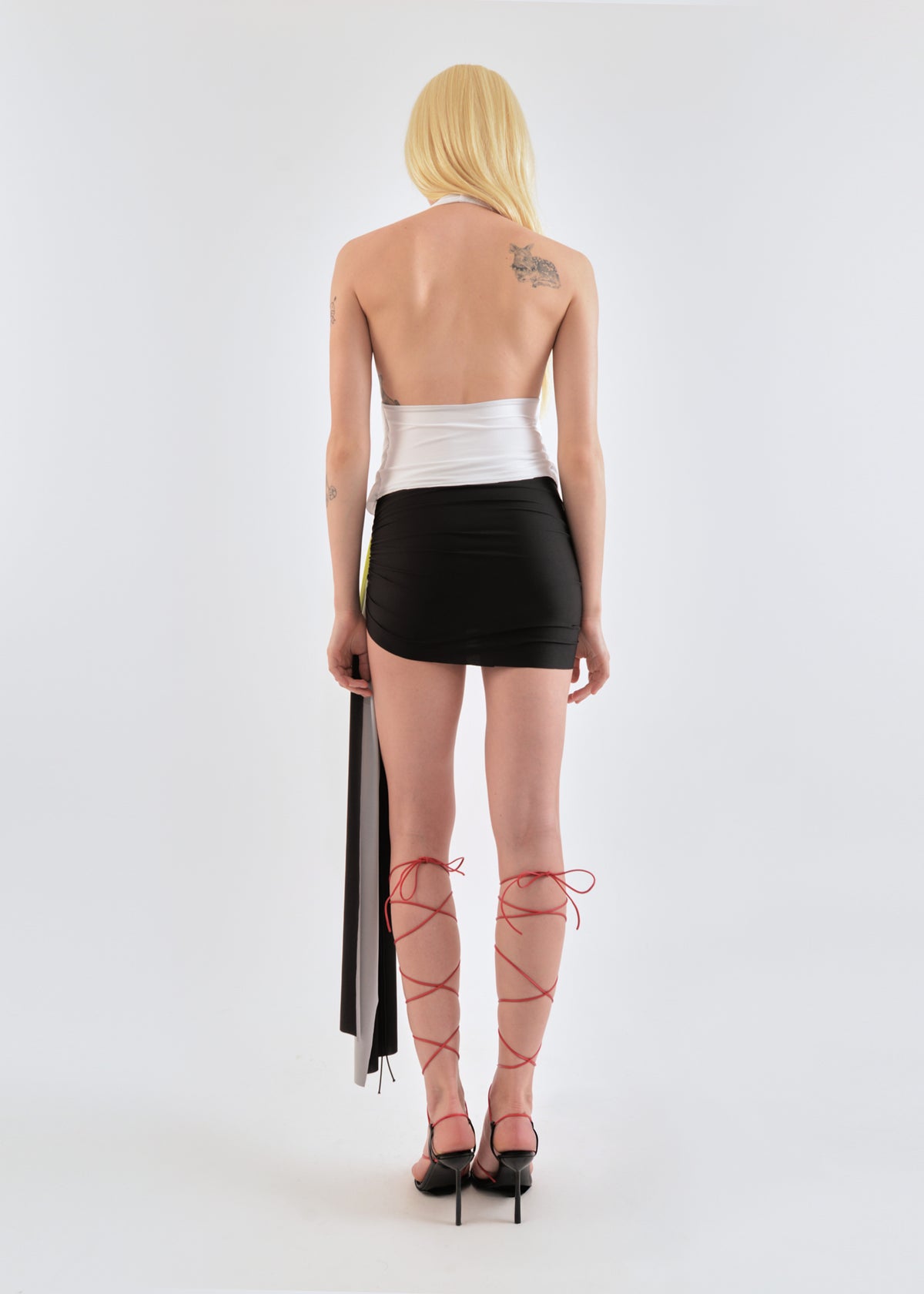 Signature mini jersey skirt in lime/wine